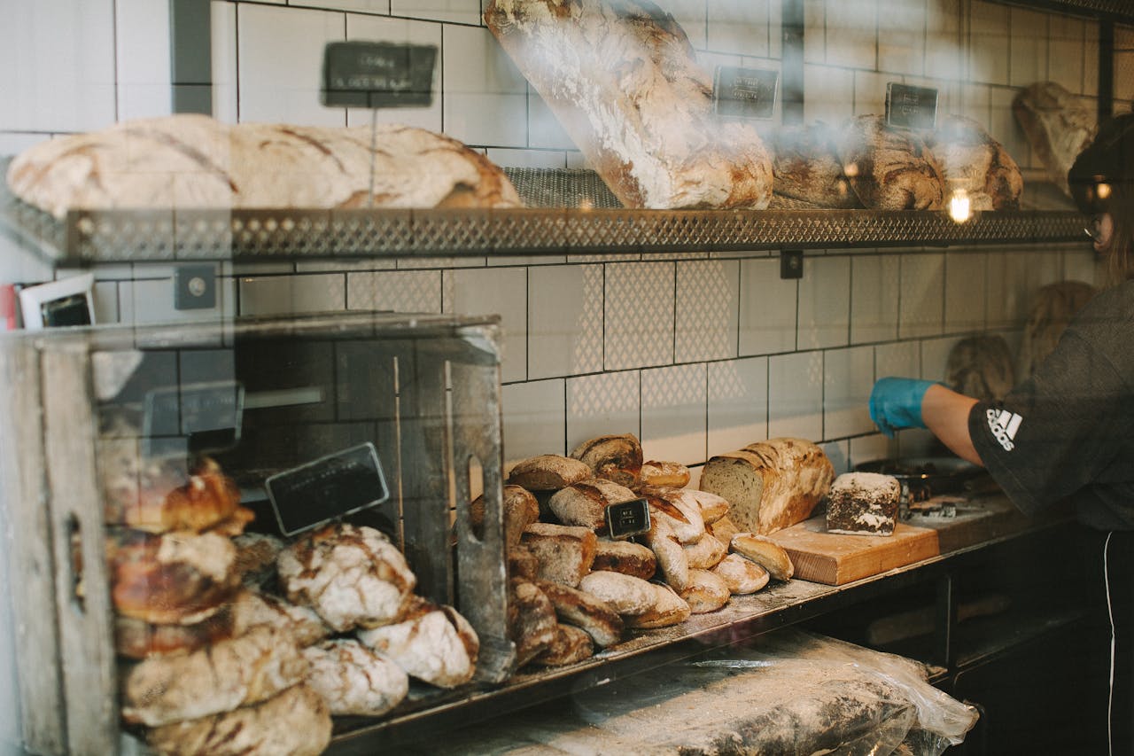 Delicious variety of freshly baked breads and pastries in a charming London bakery.